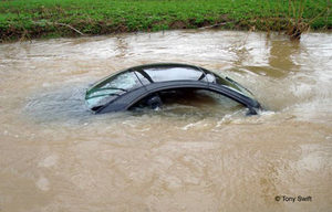 Picture of another car stuck in a
          river
